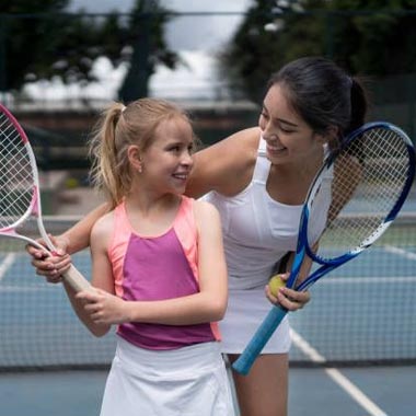 girls learning tennis, National Tennis School